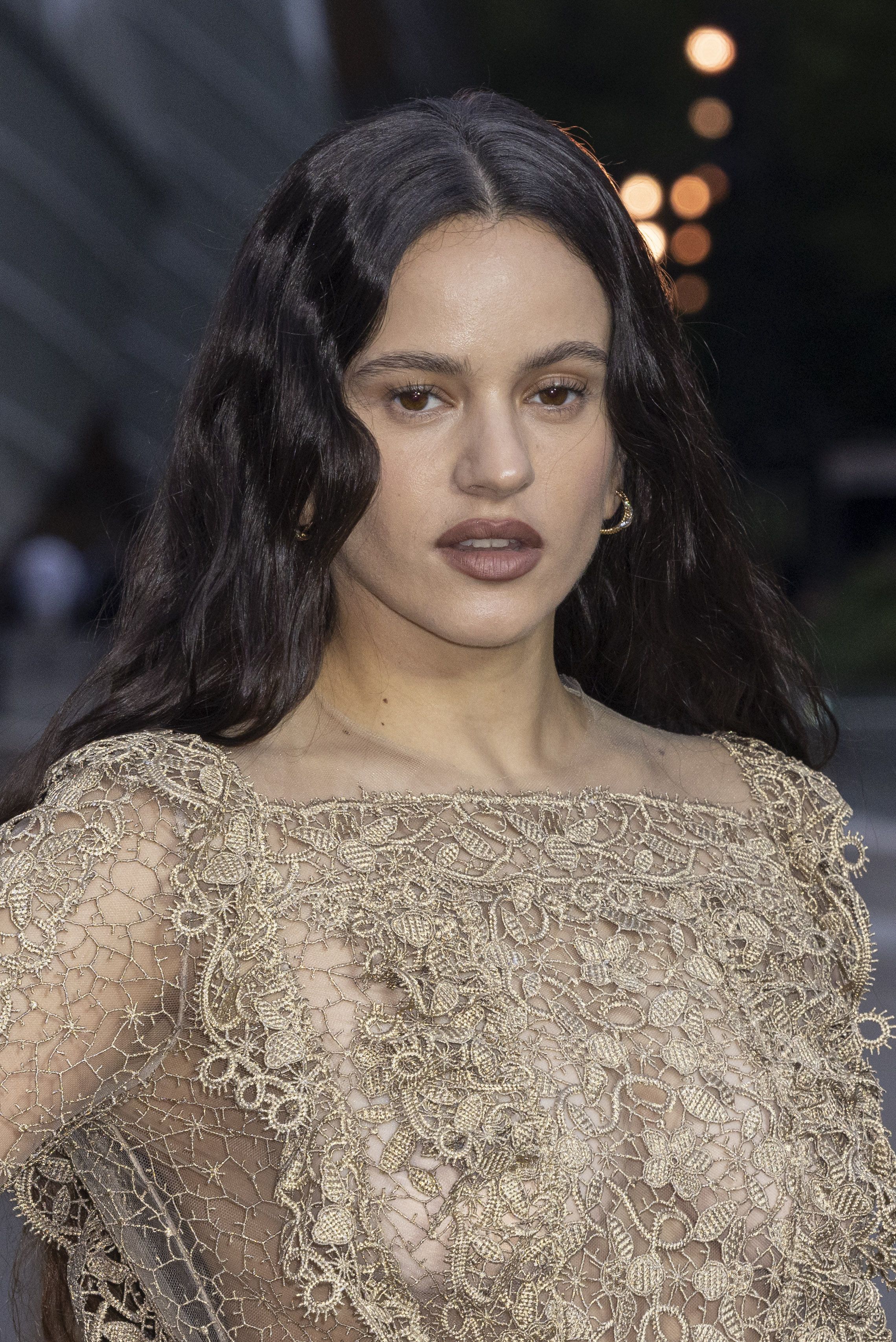 Rosalía goes braless in lace naked dress at Prelude to the Olympics