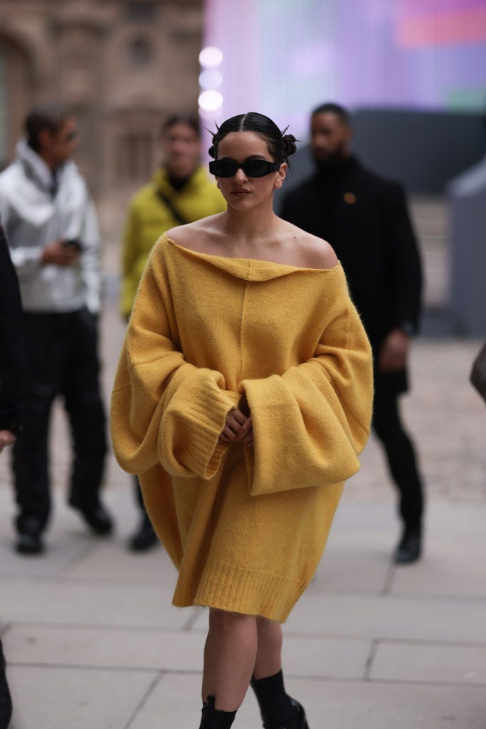 Rosalia seen wearing a yellow R. Simons oversized pullover dress