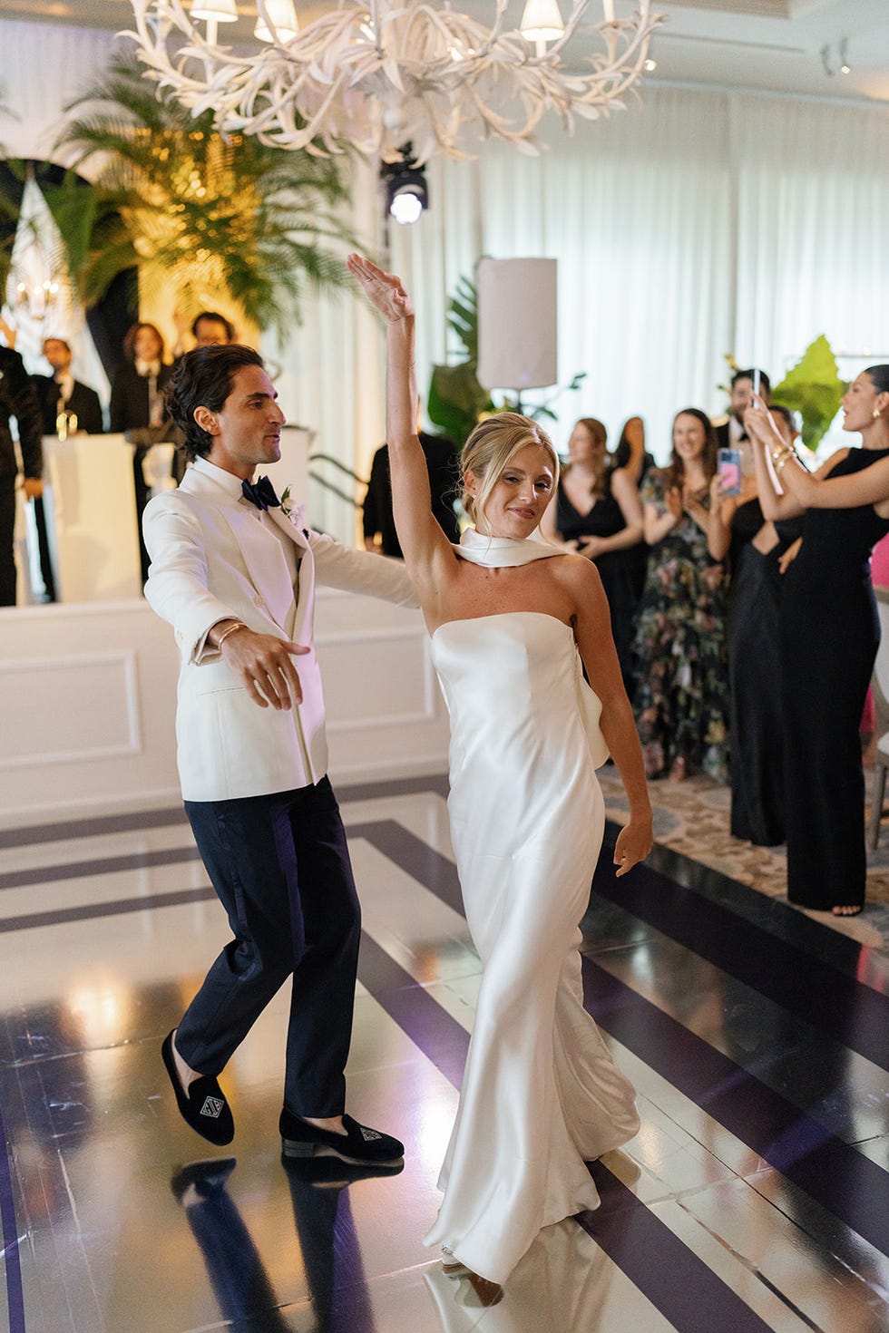 couple dancing at a celebration in formal attire