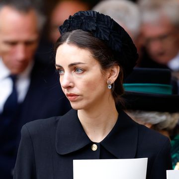rose hanbury, marchioness of cholmondeley attends a service of thanksgiving for the life of prince philip, and wears a black hat and looks off into the distance