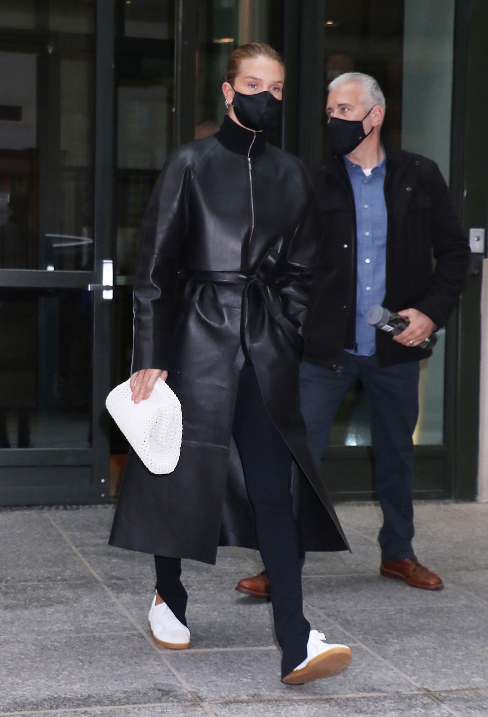 rosie huntington whiteley wears a leather trench coat to illustrate the leather trench trend