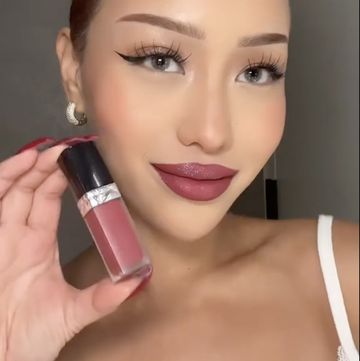 a woman with a pink lipstick