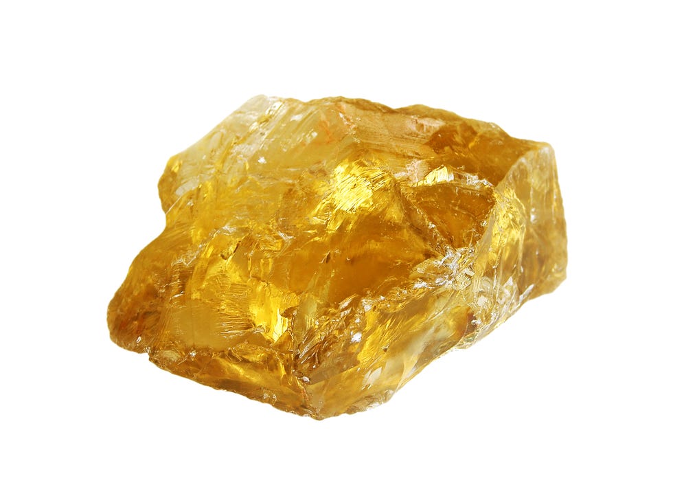 gemstone meanings rough citrine crystal on white