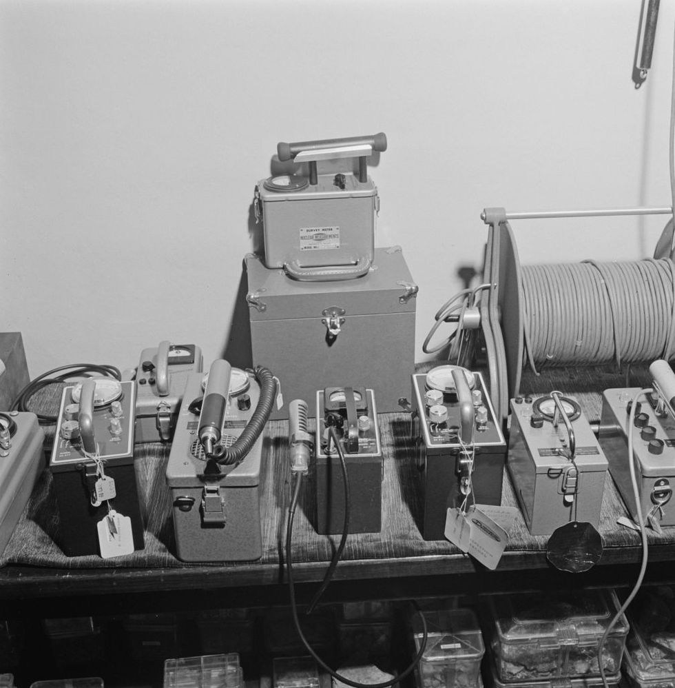 row of geiger counters in black and white archival image