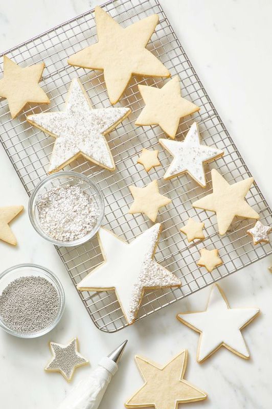 star cookies with icing on top of a wire rack