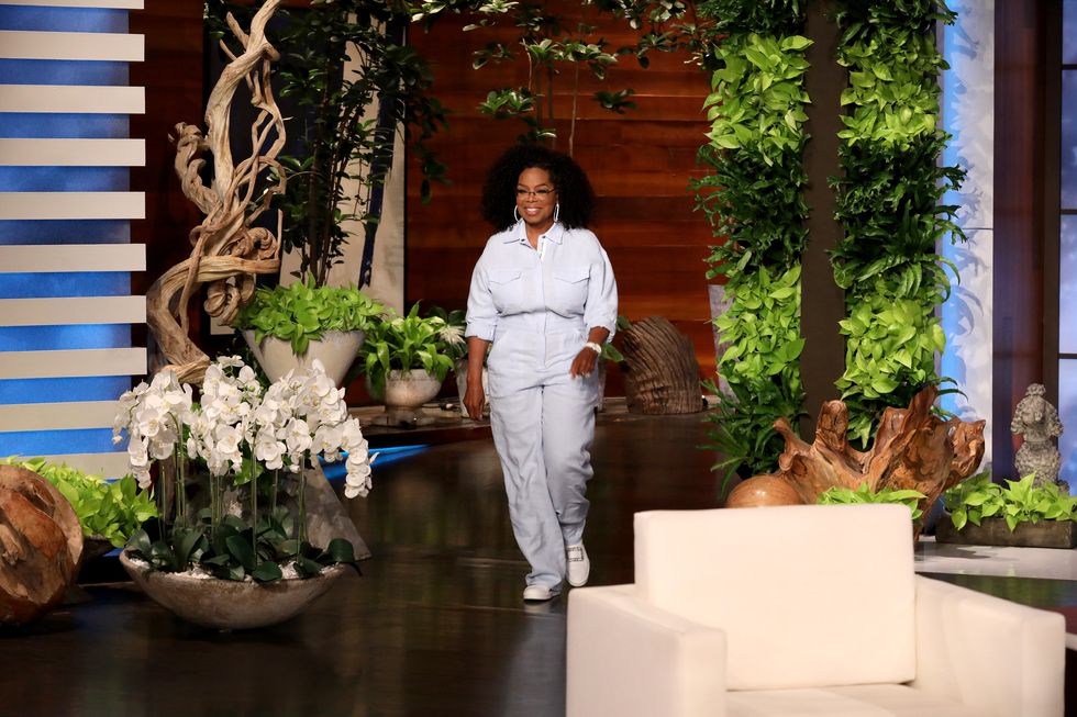 oprah walks onto the stage on the ellen show