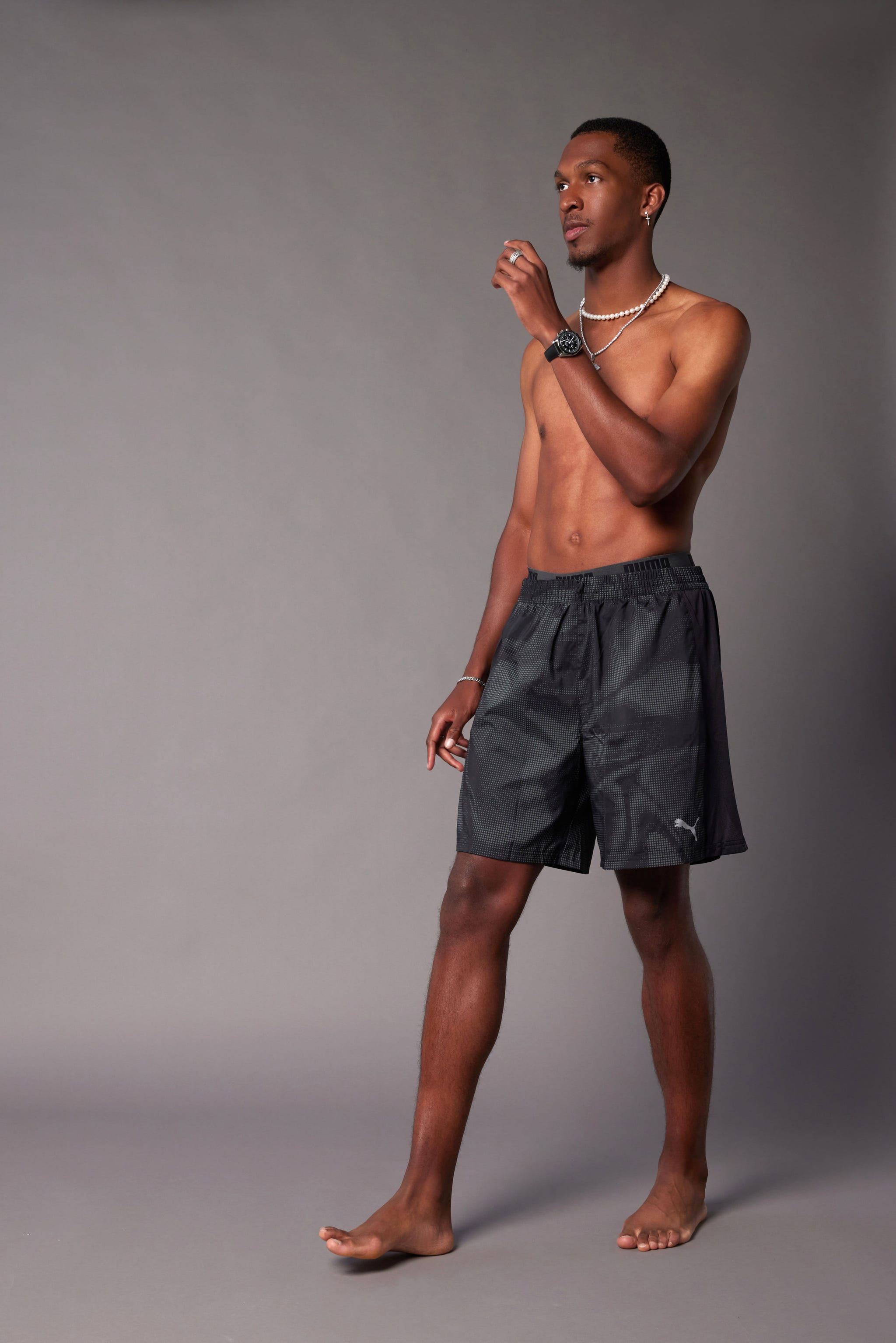 a man wearing a black shirt and shorts