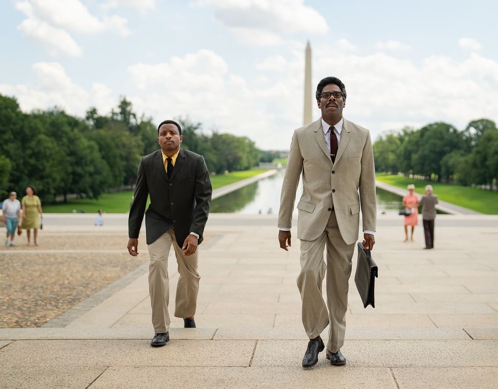 colman domingo carrying a briefcase and walking in washington dc in a scene from the movie rustin