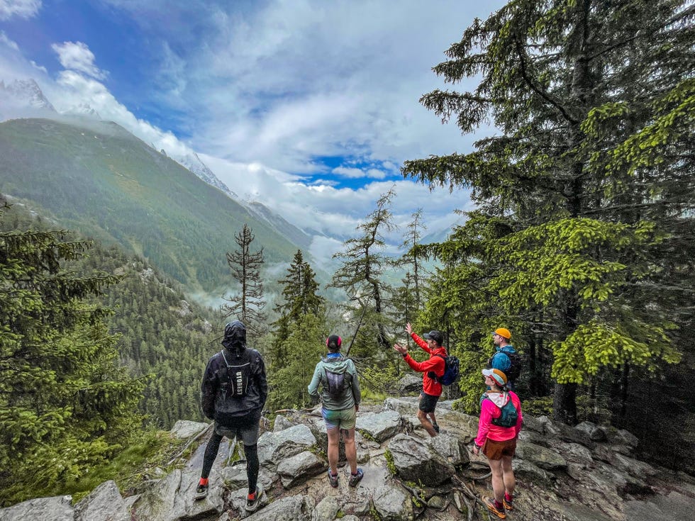 group of hikers enjoying a scenic view in a mountainous area