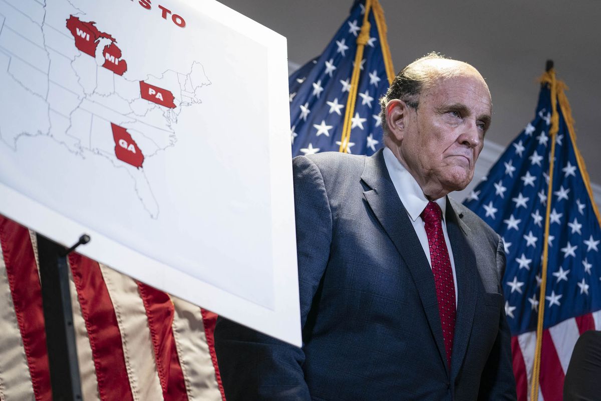washington, united states   nov 19 former new york city mayor rudy giuliani, lawyer for us president donald trump, stands next to a map showing the swing states during a news conference about lawsuits related to the presidential election results at the republican national committee headquarters in washington, dc, on thursday nov 19, 2020 photo by sarah silbiger for the washington post via getty images