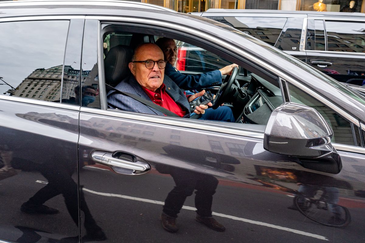 new york, ny   october 25 former new york city mayor and president trump's personal attorney rudy giuliani drives by a march and rally for president donald trump on october 25, 2020 in new york city as the november 3rd presidential election nears, trump supporters and protestors have taken to the streets to be heard photo by david dee delgadogetty images