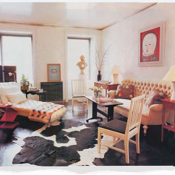 rufino report archive, living room, cow hide rug, wooden chair