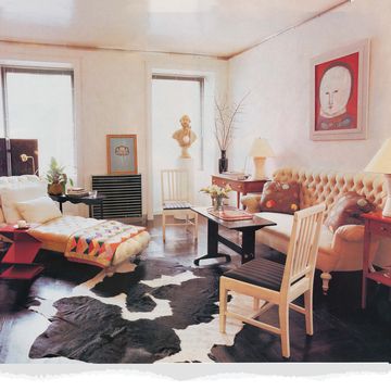 rufino report archive, living room, cow hide rug, wooden chair