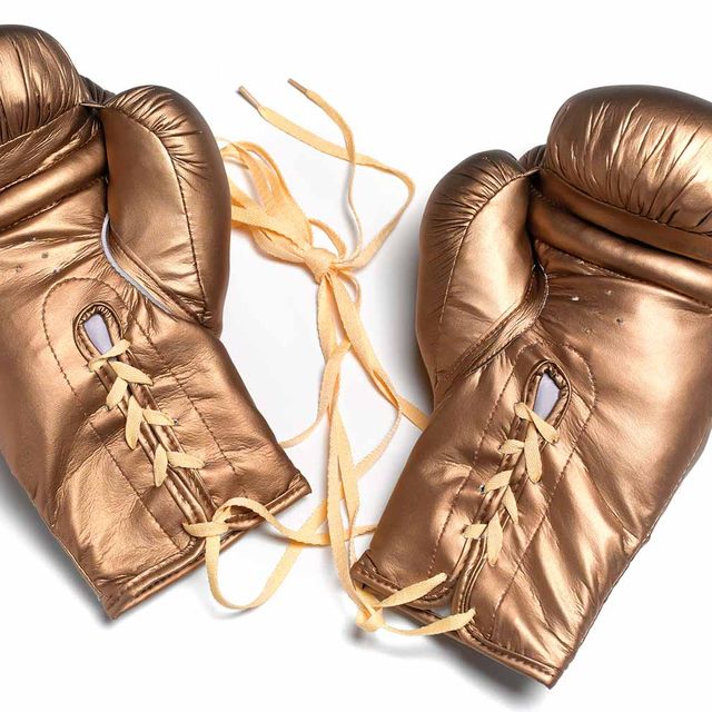 Boxing glove, Glove, Personal protective equipment, Boxing equipment, Leather, Fashion accessory, Sports equipment, Metal, 