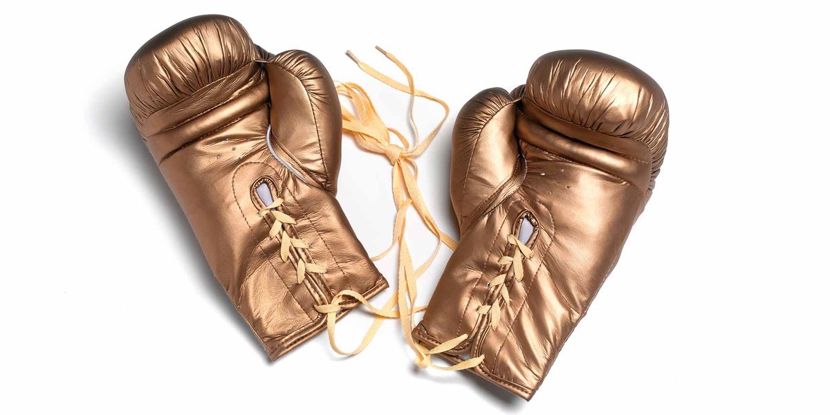 Boxing glove, Glove, Personal protective equipment, Boxing equipment, Leather, Fashion accessory, Sports equipment, Metal, 