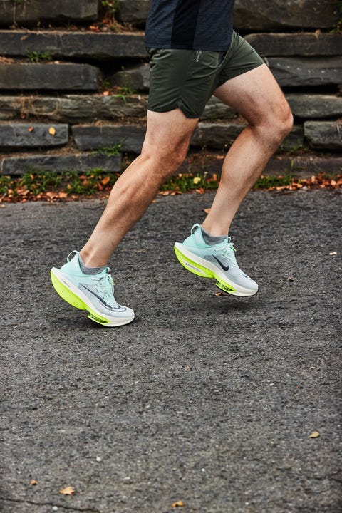 a person running in a pair of nike alphafly 2 running shoes