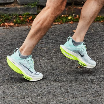 Best Carbon Plate Running Shoes a person running in a pair of nike alphafly 2 running shoes