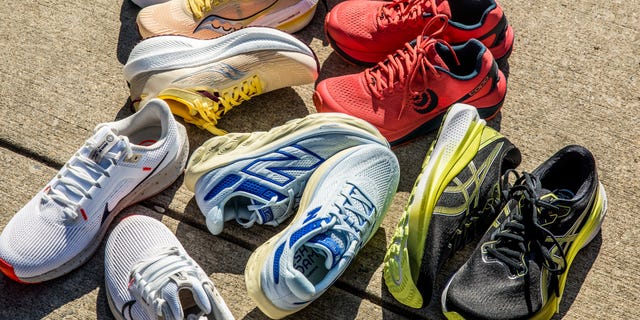 asics, new balance, nike, topo athletic, saucony running shoes on sidewalk