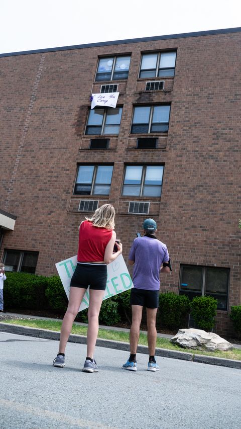 corey cappelloni speaks to his grandmother, ruth, via microphone and speakers ruth lived on the fourth floor and hung a sign out of her window that read, “i love you, corey   nana”