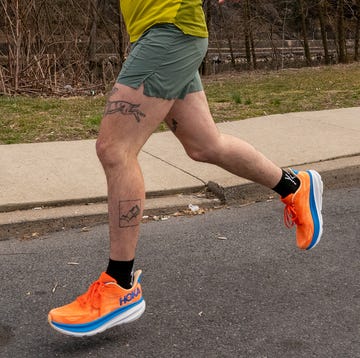 best hoka running shoes a person jogging on a sidewalk in casual athletic wear