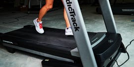person running on a treadmill in a gym setting