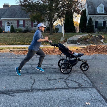 best jogging strollers a man jogging pushing a stroller with a child in it