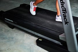 a person running on a nordictrack 1750 commercial treadmill