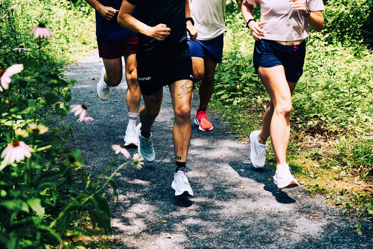 group of runners on a gravel trail