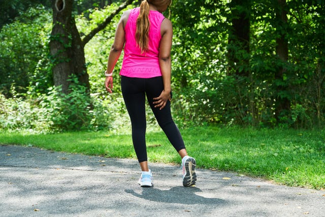 a runner holding her hamstring