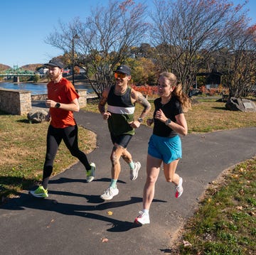 two men and a woman running side by side two men and a woman running side by side