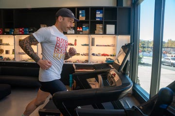 person running on a treadmill in a running store