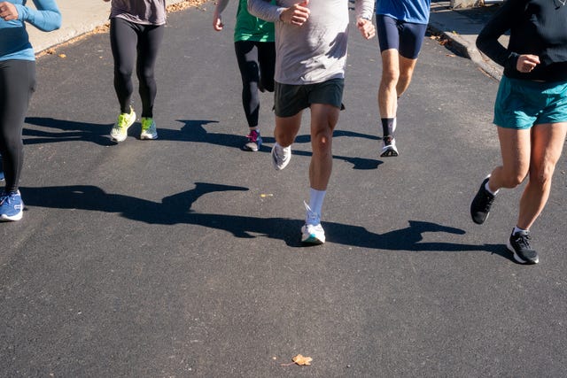 group running together on road