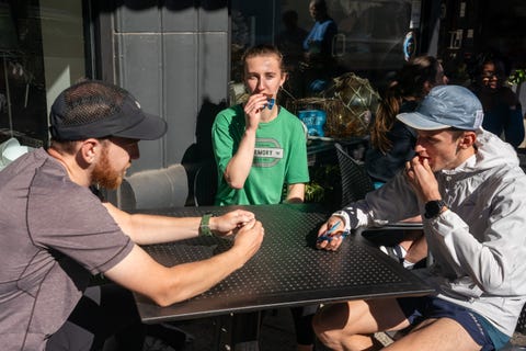 group of runners eating at a table