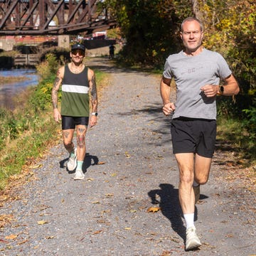 two runners on a trail two runners on a trail