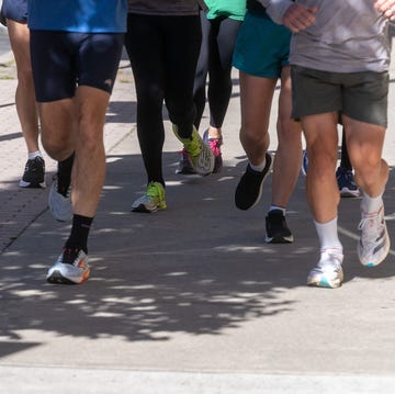 best 5k running shoes a group of people running down the sidewalk