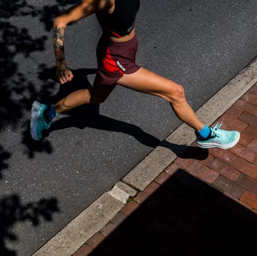 best women's running shoes a woman running in a pair of hoka running shoes