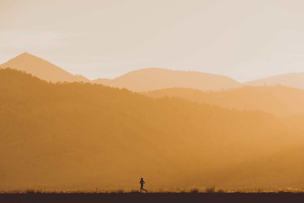 runner against a background of the layers of the rocky mountains