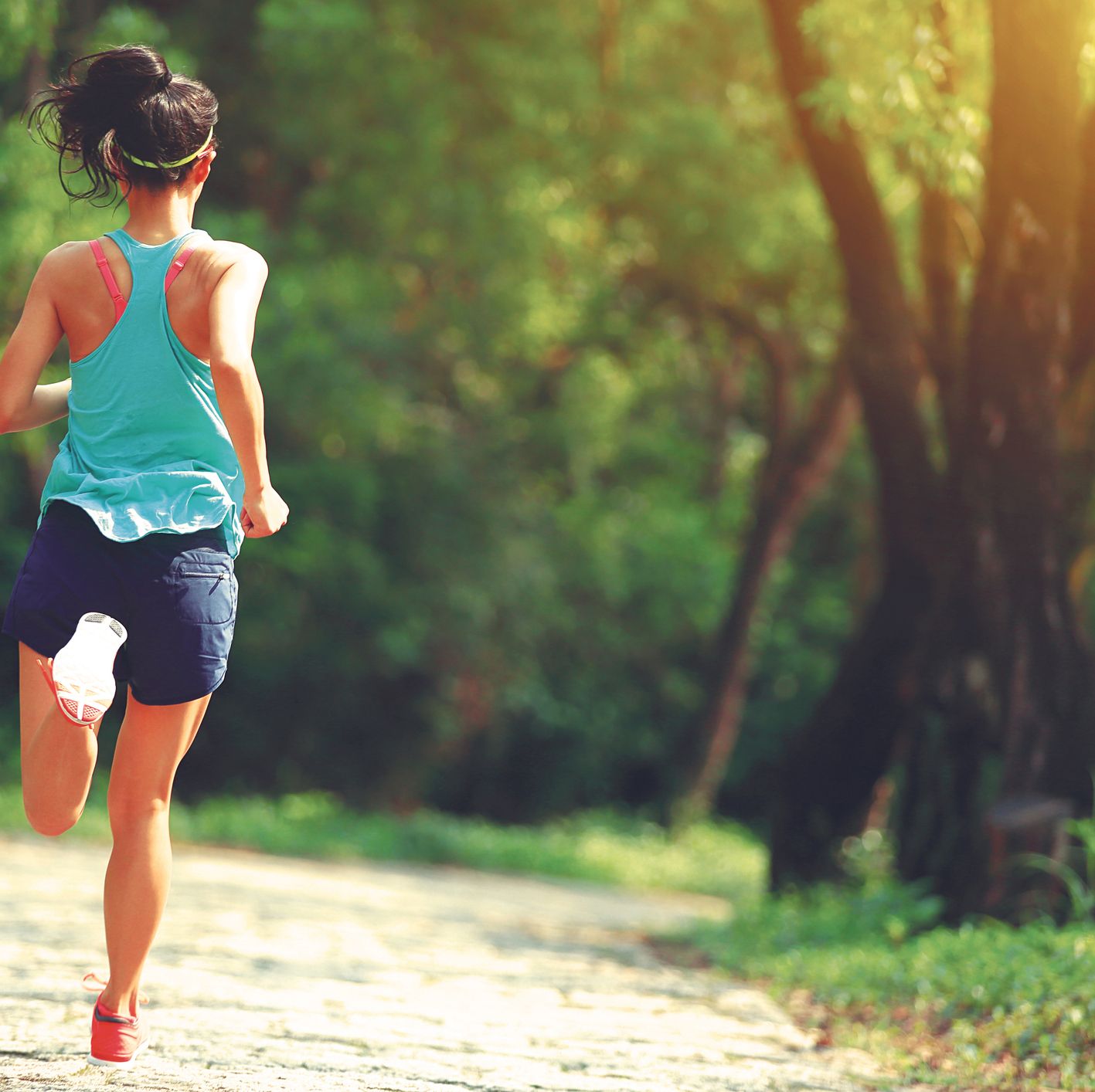 Girl running in park - Stock Image - F022/6972 - Science Photo Library