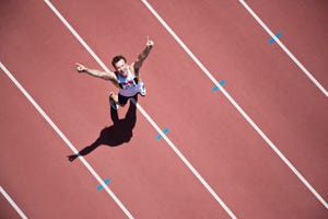 runner cheering on track