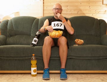 Runner eating chips on sofa