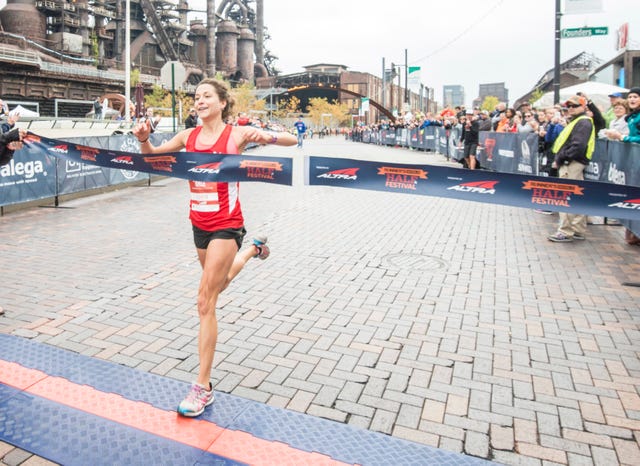 runner finish line half marathon
