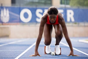 runner in start block on track