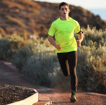 runner on sandy road in dry environment