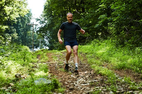 eic jeff dengate moving  down   a wooded outdoor trail