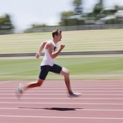 runner sprinting on track