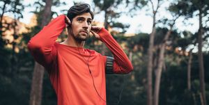 runner wearing earphones during workout