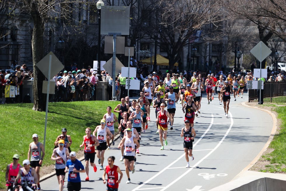 runners on road at boston marathon