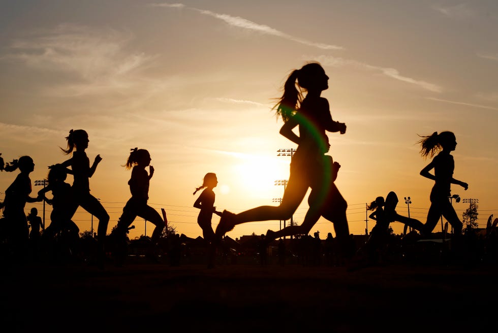 runners compete in a 5k at sunset in corona, california
