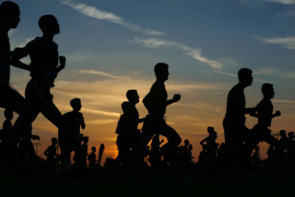 runners compete in a 5k at sunset in corona, california