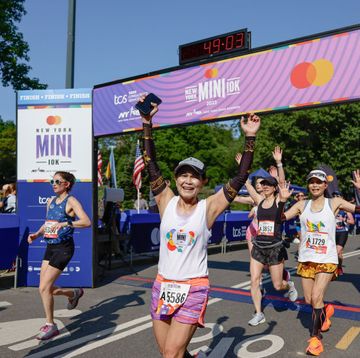 crossing the finish line at the new york mini 10k race